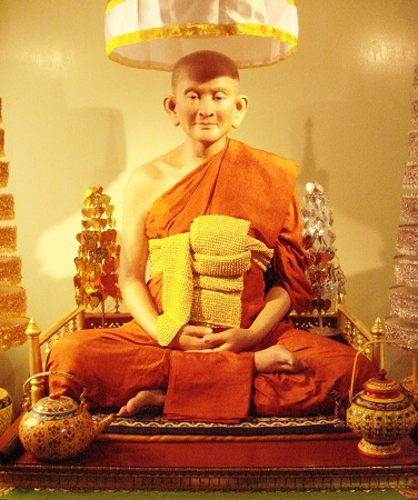 A statue of a monk

Description automatically generated